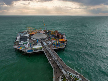 Aerial view of brighton palace pier, with the seafront behind.