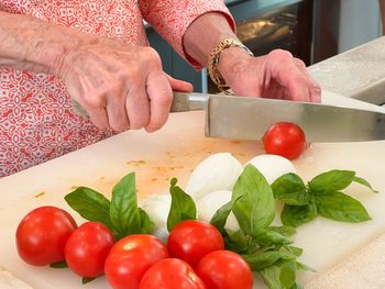 Midsection of woman preparing food