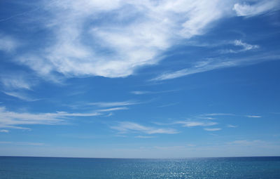 Scenic view of sea against blue sky