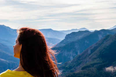 Rear view of woman looking at mountains