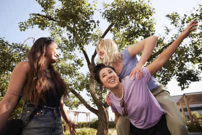 Young female friends having fun together outdoors