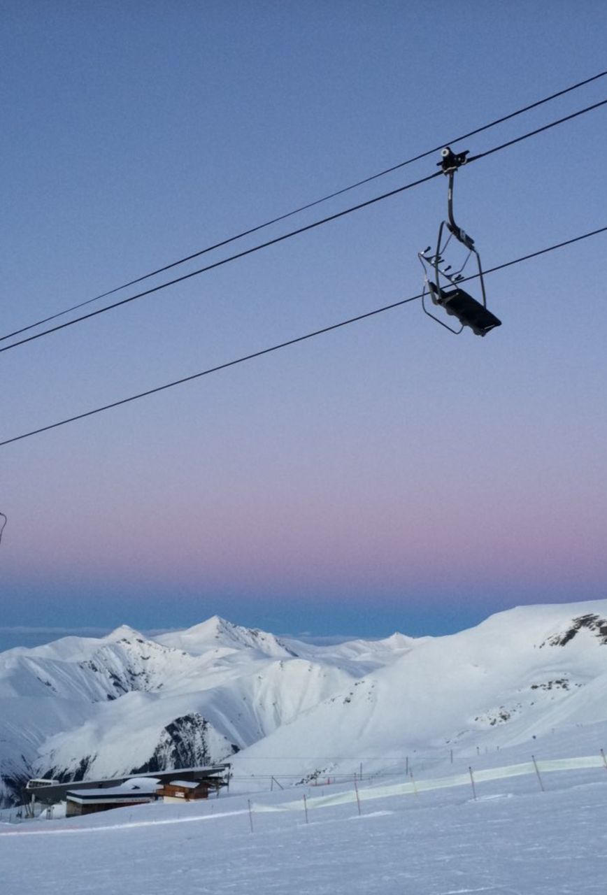 LOW ANGLE VIEW OF OVERHEAD CABLE CAR AGAINST SKY