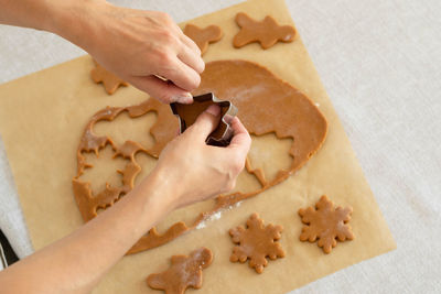 Cropped hand of person preparing food