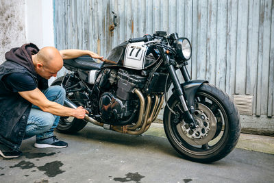 Side view of a young man on motorcycle