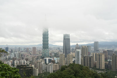 Modern buildings against sky in city