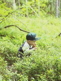 Rear view of boy on field