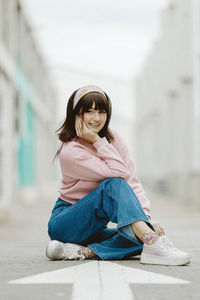 Portrait of a girl sitting outdoors