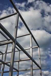 Low angle view of metallic structure against sky