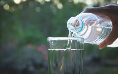 Close-up of hand holding glass