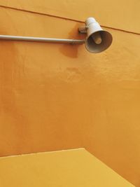 Megaphone on orange wall