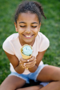 Portrait of a smiling girl holding ice cream