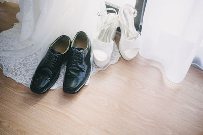 High angle view of shoes on hardwood floor
