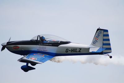 Airplane flying against sky