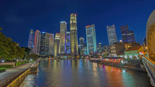 Illuminated buildings in city at night,,marina bay sand singapore