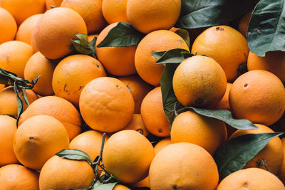 Full frame shot of oranges at market stall