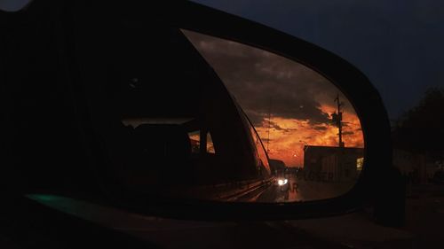 Reflection of sky on side-view mirror