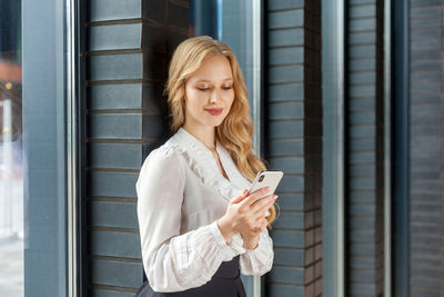 Young woman using mobile phone