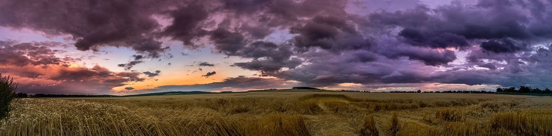 Panoramic view of landscape against cloudy sky