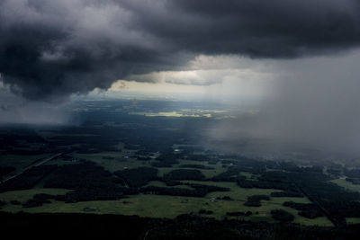 Scenic view of landscape against cloudy sky