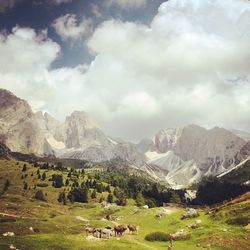 Scenic view of mountains against cloudy sky