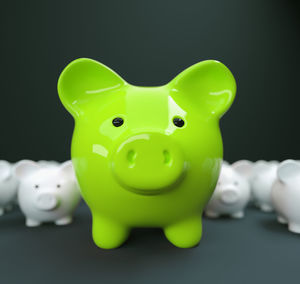 Close-up of green toy over black background