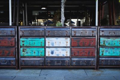 Stack of old metallic containers outdoors