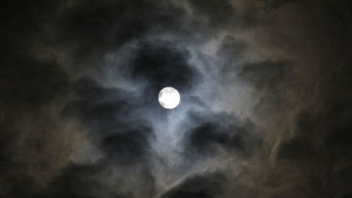 Low angle view of moon against sky at night