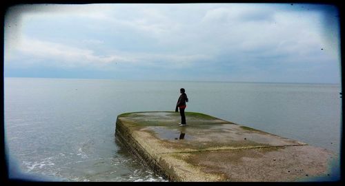 Man on beach against sky