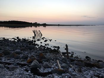 Scenic view of calm sea at sunset