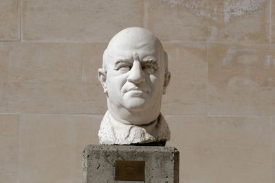 Close-up of statue against wall