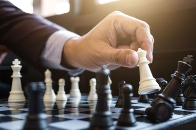 Cropped image of businessman playing chess