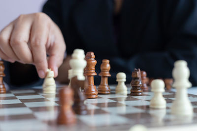 Low angle view of man playing on chess