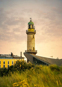 Golden light during sunset on old lighthouse warnemünde