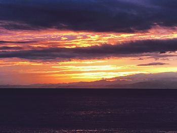 Scenic view of dramatic sky during sunset