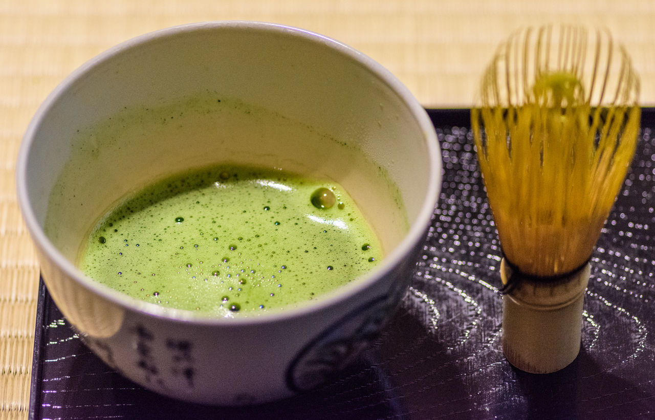 CLOSE-UP OF DRINK IN BOWL WITH TABLE