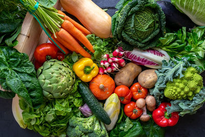 Fresh colorful vegetables taken from above on a grey wood background