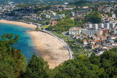 High angle view of buildings and sea in city