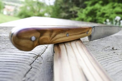 Close-up of skateboard on bench