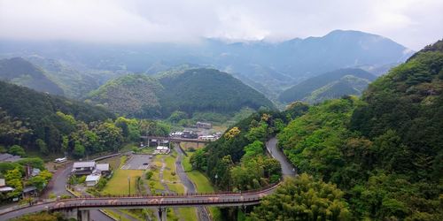 High angle view of trees and mountains against sky