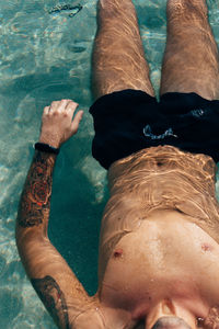 High angle view of man swimming in pool