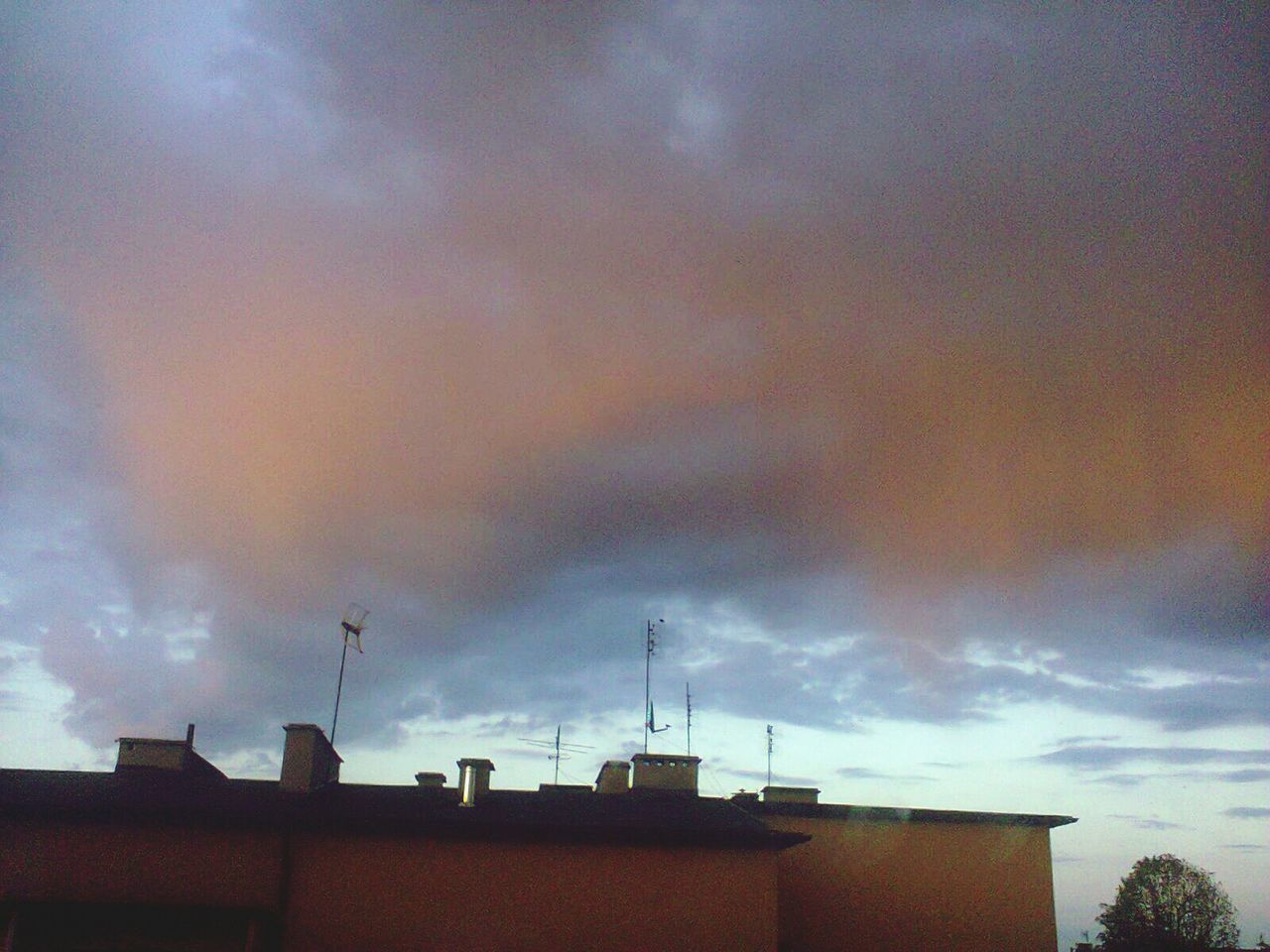 building exterior, sky, architecture, built structure, cloud - sky, low angle view, cloudy, weather, cloud, house, overcast, high section, building, residential structure, storm cloud, residential building, dramatic sky, sunset, nature, outdoors