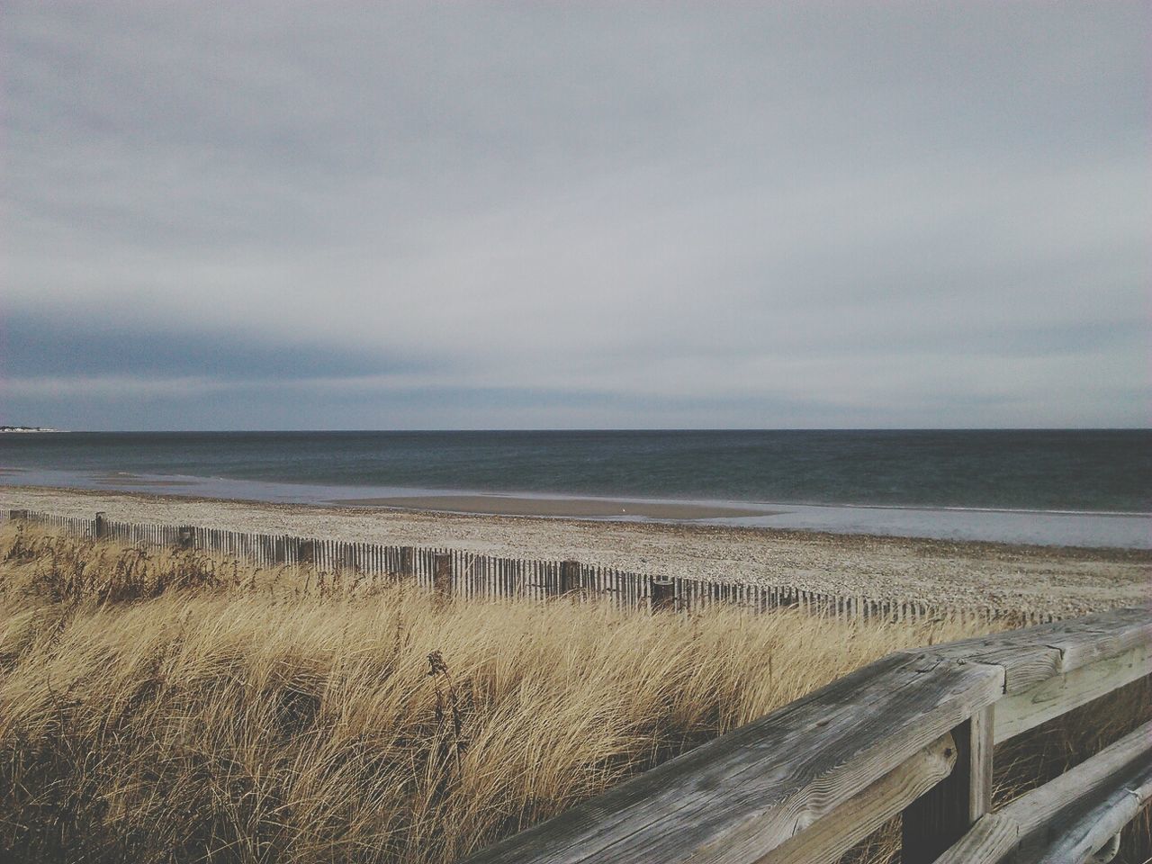 sea, horizon over water, sky, beach, water, tranquil scene, tranquility, scenics, shore, cloud - sky, beauty in nature, nature, sand, cloudy, idyllic, cloud, pier, outdoors, calm, day