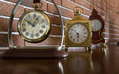 Close-up of old clock on table