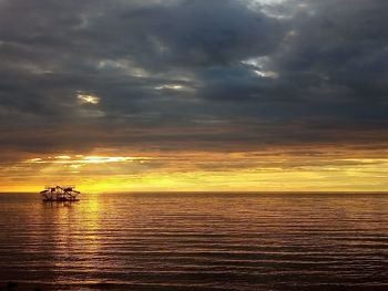 Scenic view of dramatic sky over sea