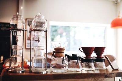 Various glass containers on table at home