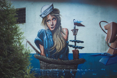 Portrait of young woman wearing hat