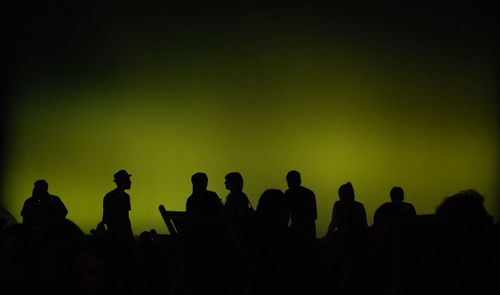 Silhouette people standing against white background