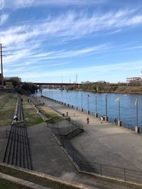 Pier over river against sky