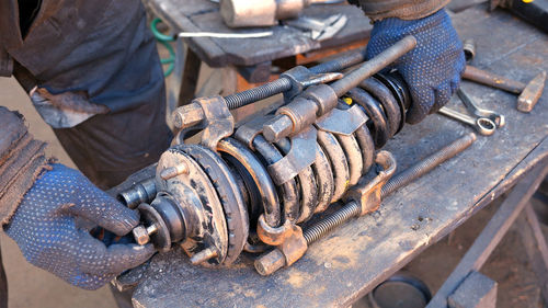 Low section of man working on barbecue grill