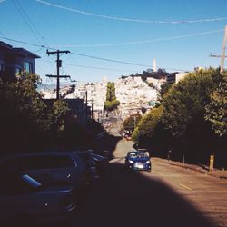 Power lines against blue sky